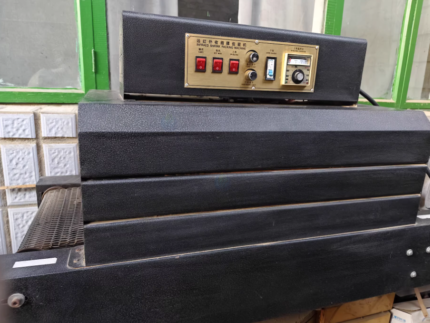 沧州市地区工厂处理尚云智能SY-800定制高效炭包机+远红外收缩膜包装机