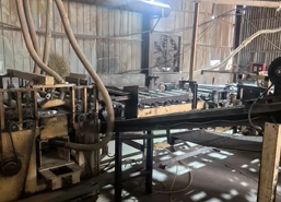 菏泽市地区工厂处理生物质锅炉 预压机 横截锯 压机18层 液压站 凉板架等